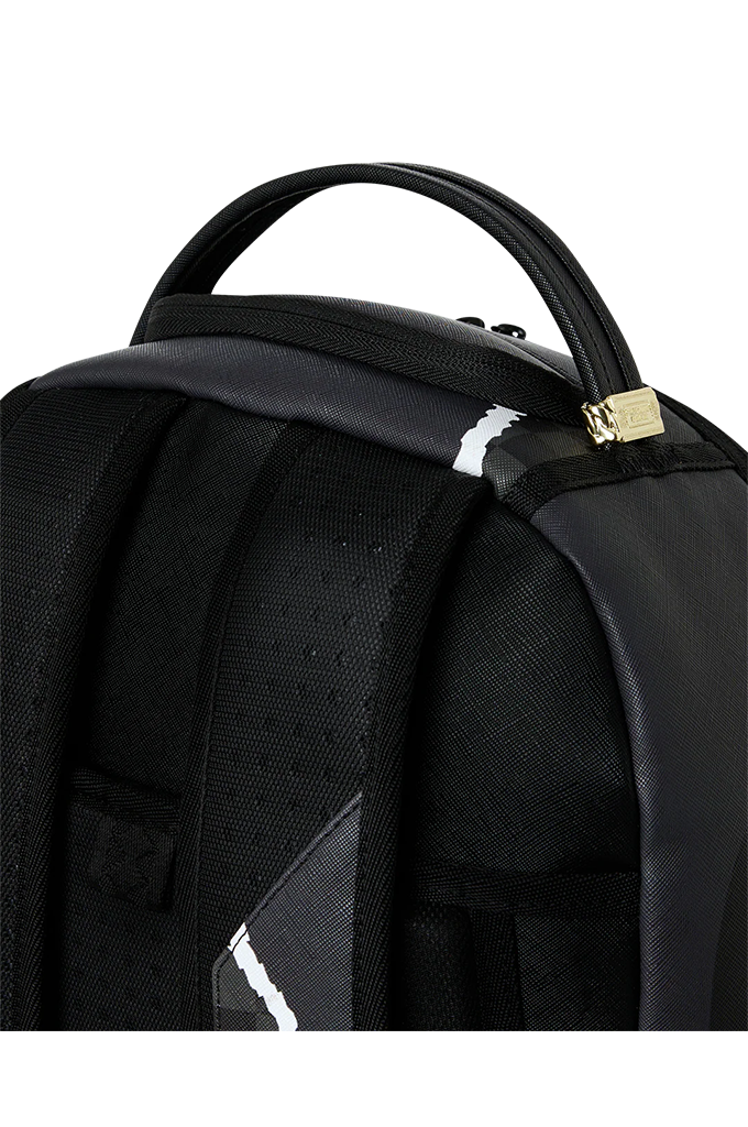 Close-up of a black backpack showing the top handle, padded shoulder straps, zipper closure with a small gold-toned pull, and a reflective white stripe detail.