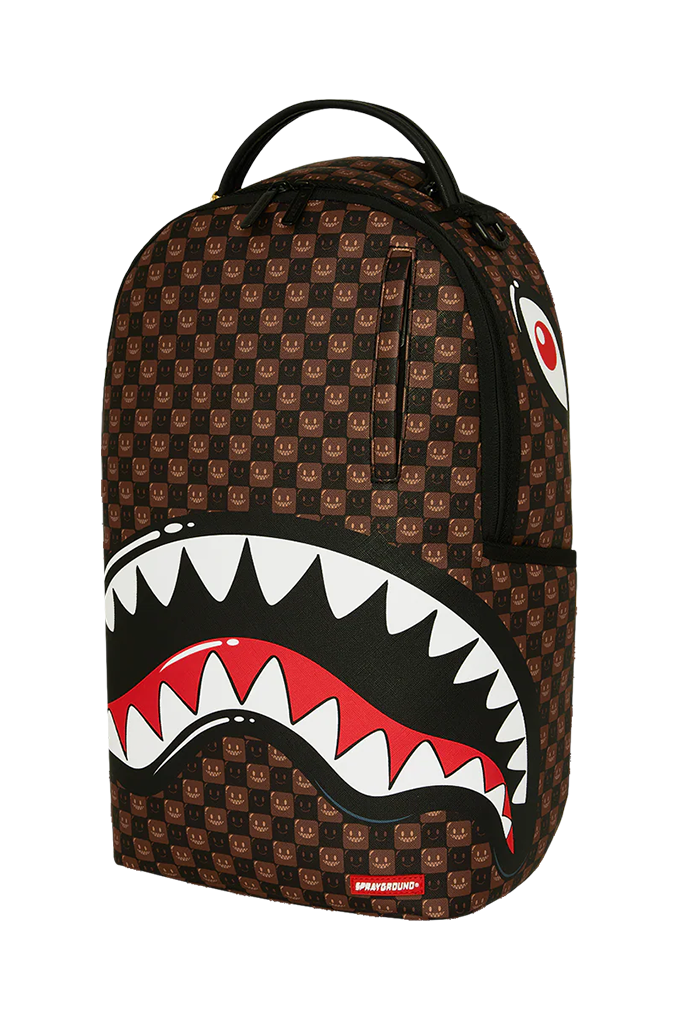 A Sprayground Shark backpack featuring a brown and black patterned body with a large shark mouth graphic in black, white, and red on the front, set against a plain white background.