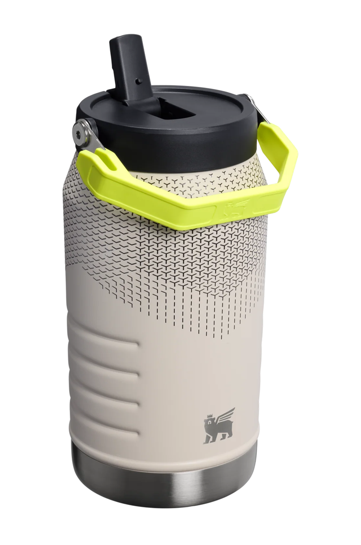 A vacuum-insulated water bottle with a light beige body, a black lid, and a bright lime green carrying handle, shown on a white background.#color_sahara-hypergrip