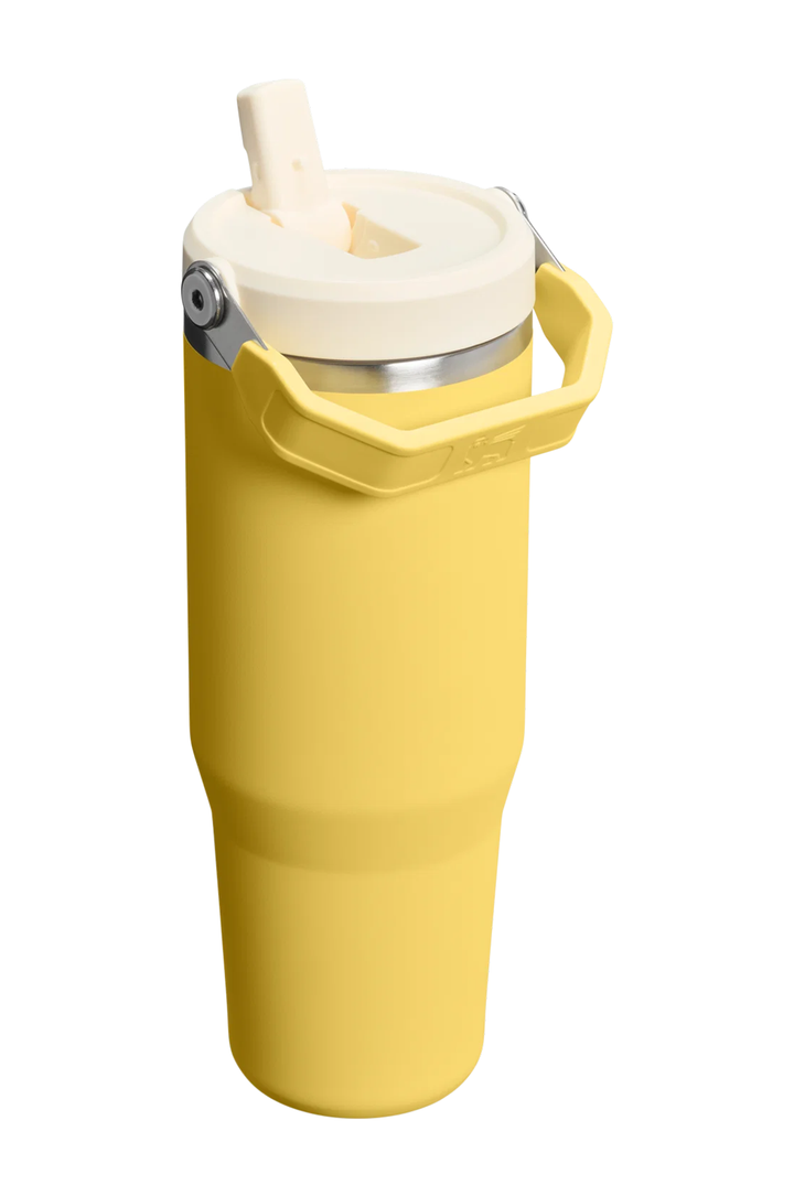 A yellow insulated travel tumbler with a cream-colored lid and carry handle, shown on a solid white background.#color_daffodil