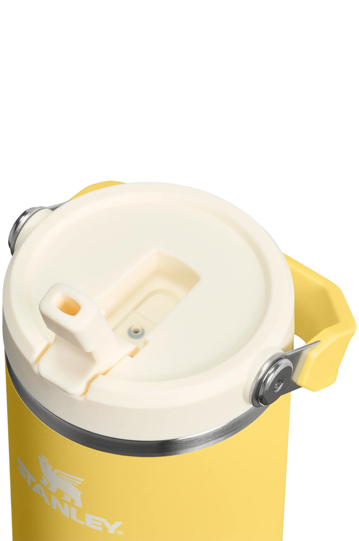 Close-up of a yellow Stanley insulated container with a cream-colored lid and a yellow handle, shown on a white background.#color_daffodil