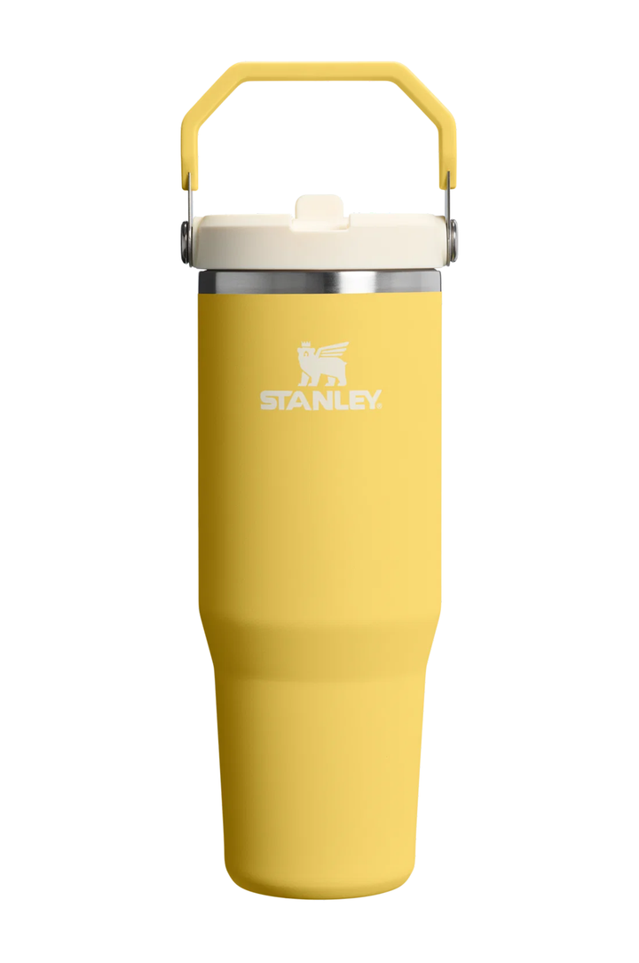 A yellow Stanley vacuum-insulated tumbler with a cream lid and a yellow carrying handle, shown on a plain white background.#color_daffodil