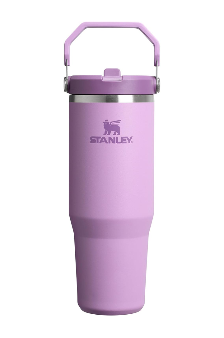 A lavender purple Stanley insulated tumbler with a matching carrying handle lid, featuring the Stanley logo on the front, set against a plain white background.#color_lilac