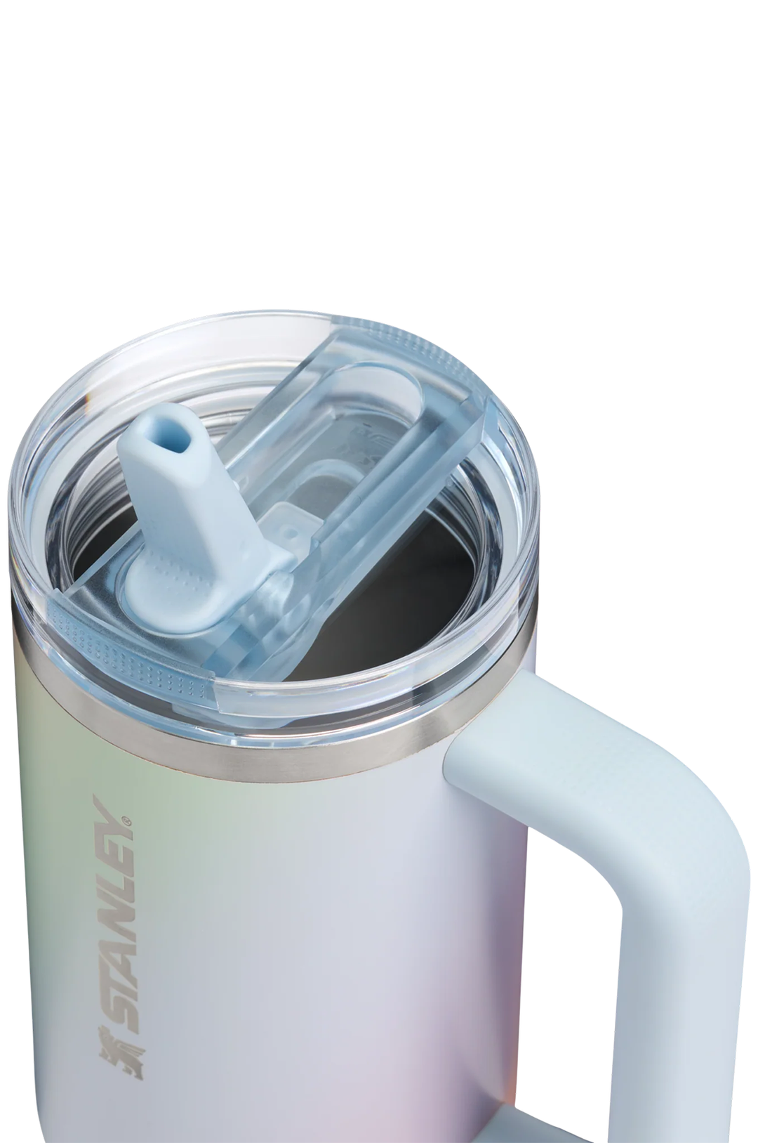 Close-up of a Stanley insulated tumbler with a clear lid and light blue flip straw, featuring a pale iridescent body and a side handle on a white background.#color_sunrise-spiral