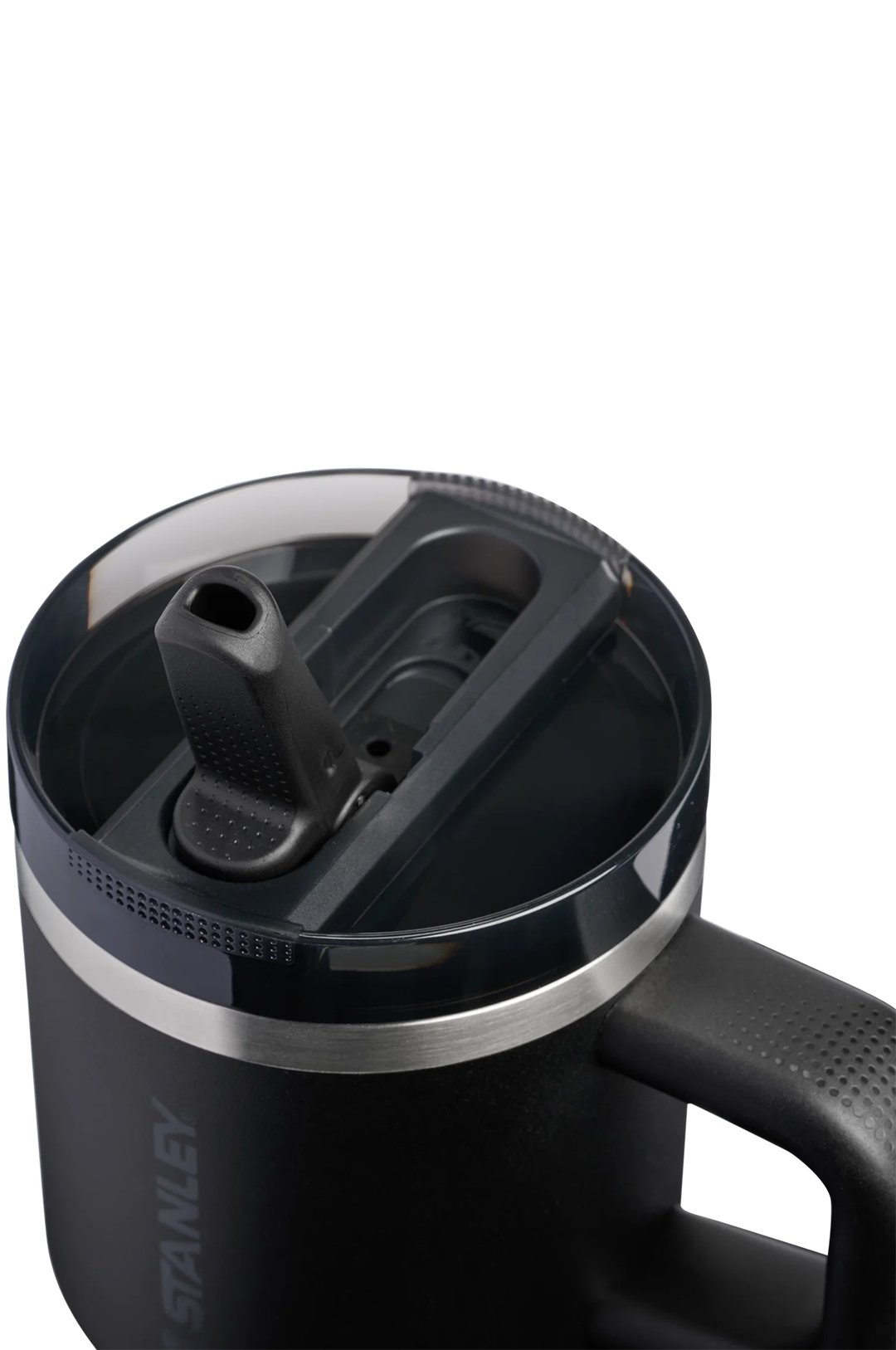 Close-up of a black Stanley insulated mug with a clear lid and flip-top spout, showing the Stanley branding on the side against a white background.#color_black