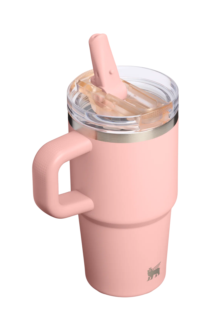 A dusty pink insulated travel tumbler with a matching handle and straw, featuring a clear lid with a metallic rim, on a solid white background.#color_peach-rose