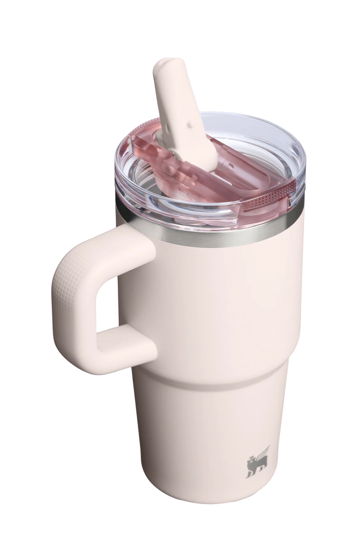 A cream-colored insulated travel tumbler with a matching handle, a clear lid, and a pink silicone straw, shown on a solid white background.#color_rose-quartz