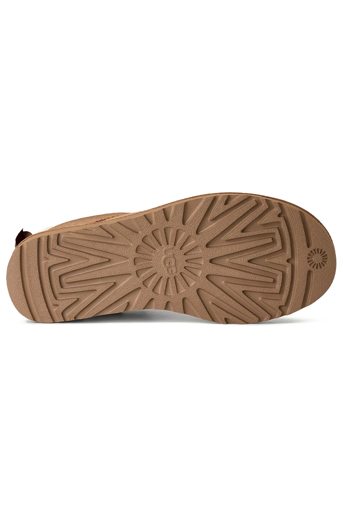 A single brown suede slipper boot shown from the bottom against a plain white background.