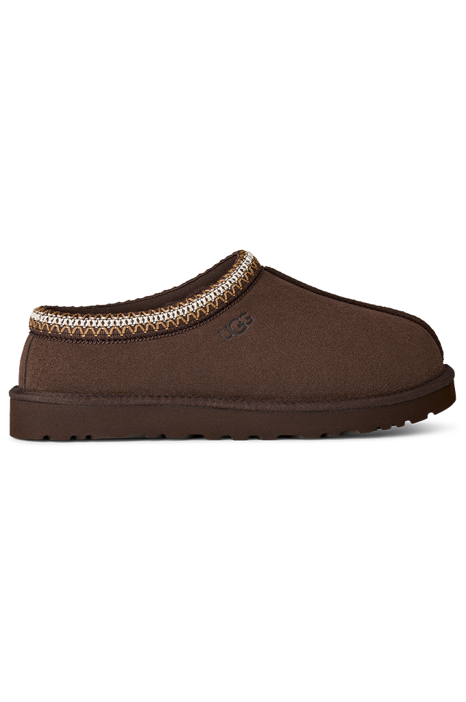 A single brown slip-on clog-style shoe with a textured fabric upper, a decorative beige and brown patterned trim around the collar, and a thick brown sole, shown against a plain white background.#color_dusted-cocoa