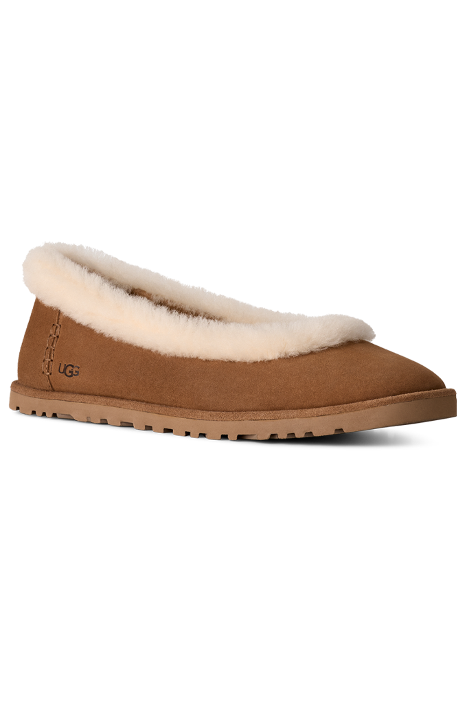 A single UGG slip-on slipper in tan suede with a cream shearling collar, shown from a side profile on a white background.