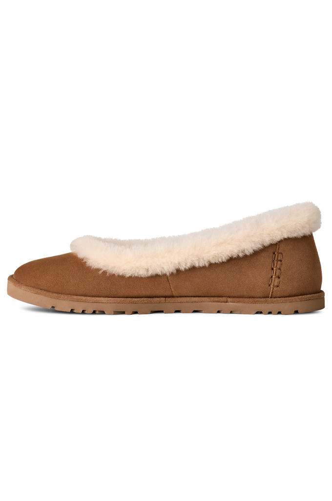 A single brown suede slipper with a thick cream-colored shearling lining and collar, shown in a side profile view against a plain white background.