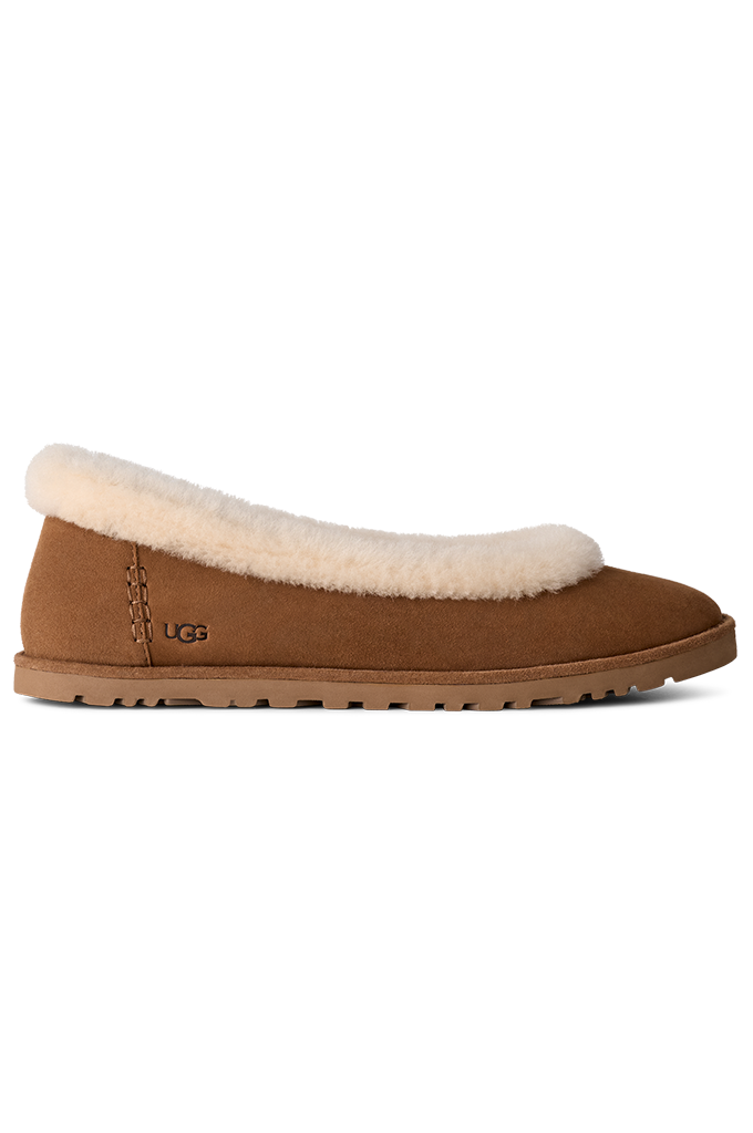 A single brown UGG slip-on shoe with a thick cream-colored shearling lining on the collar, shown from a side profile view against a plain white background.