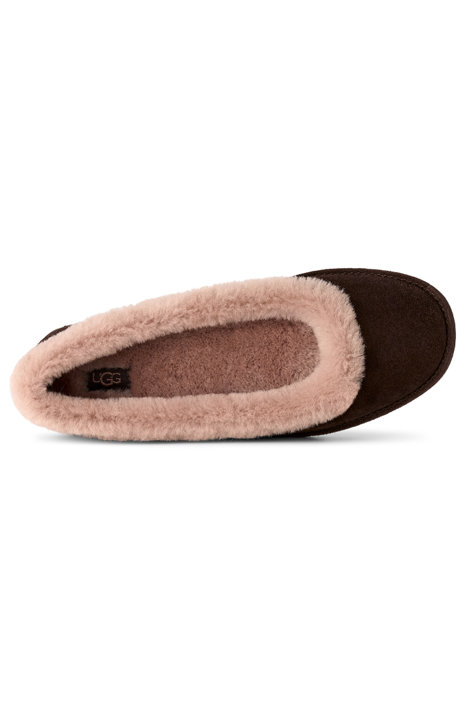 A single UGG slipper shown from a side profile view, featuring a dark brown suede-like exterior and a soft, light pink shearling lining.