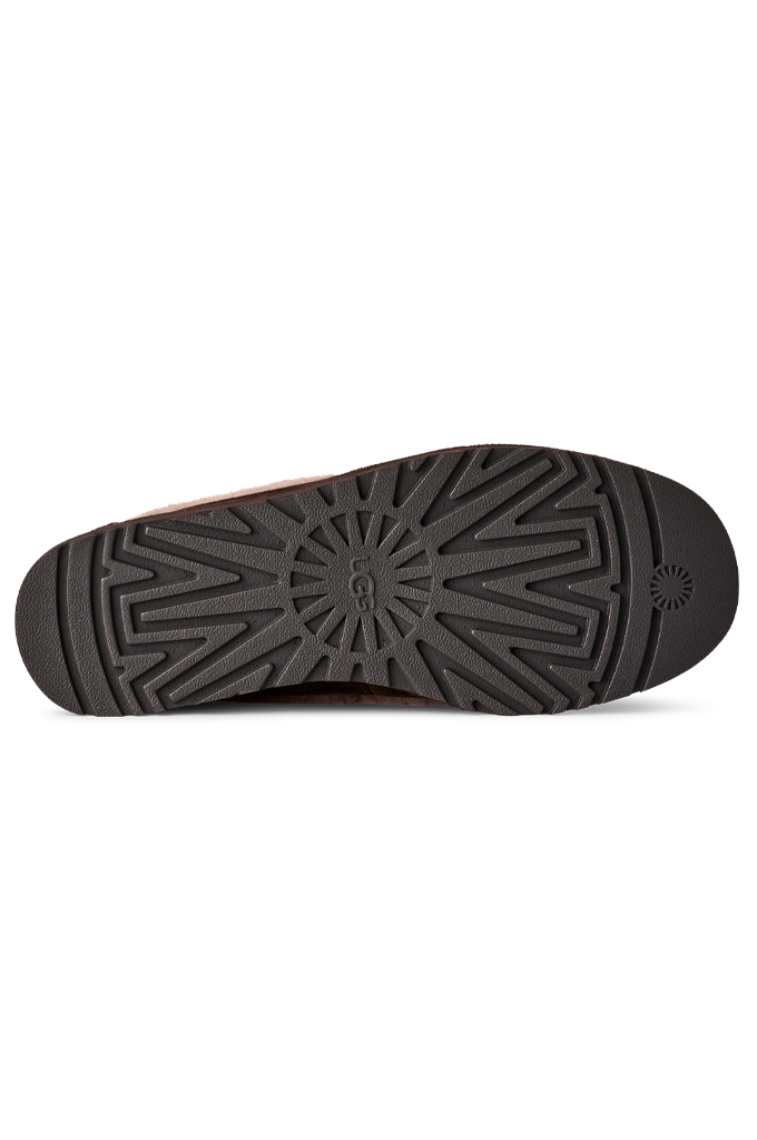 Black rubber stamp with text on a white background