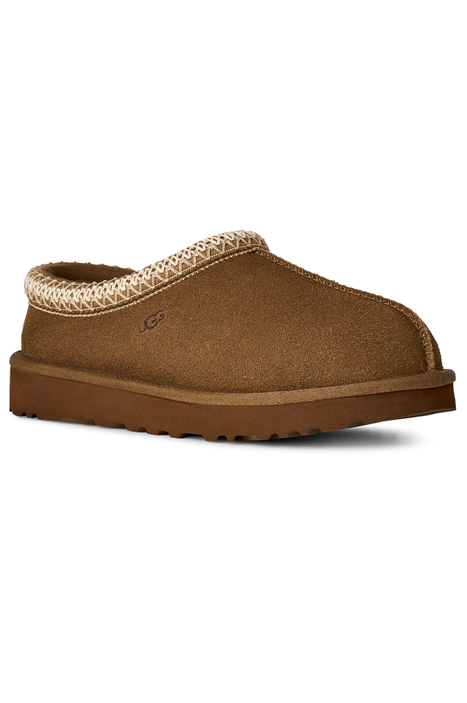 A single brown suede slipper with a braided beige trim around the collar and a brown sole, shown on a plain white background.#color_light-bronze