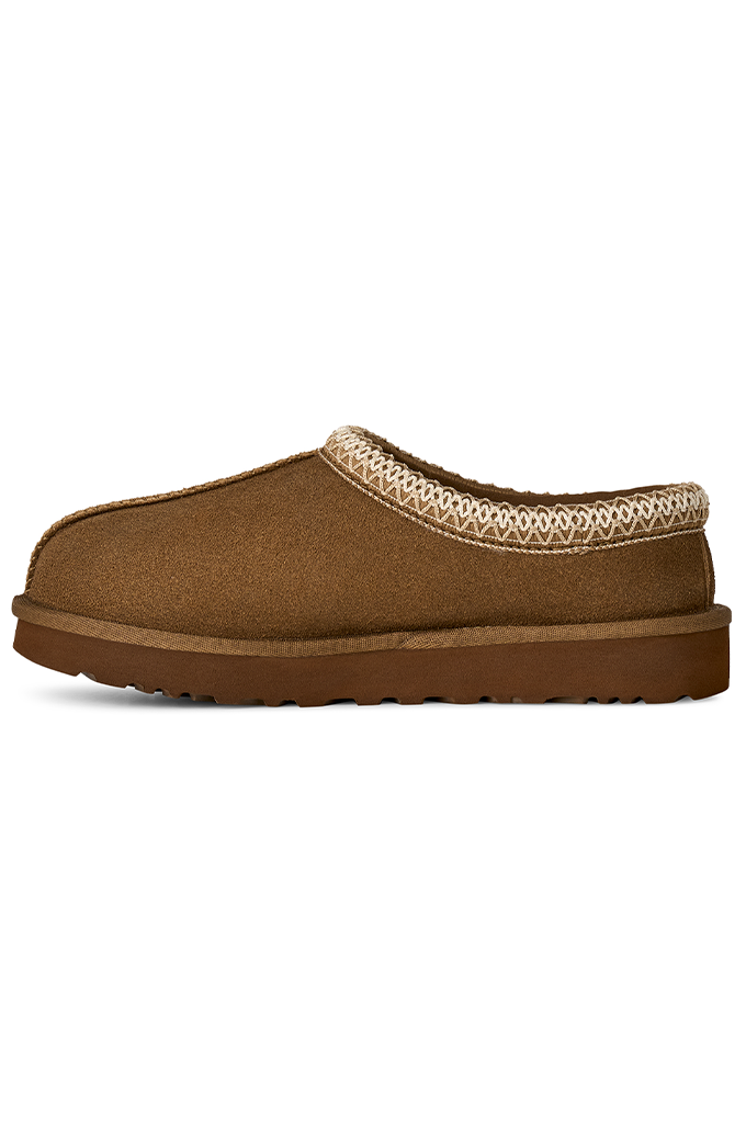 A single brown suede slip-on clog-style shoe with a beige geometric patterned trim around the collar and a thick brown sole, shown against a plain white background.#color_light-bronze