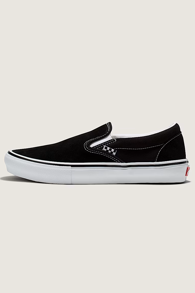 Vans slip on shoe in black with white background.  